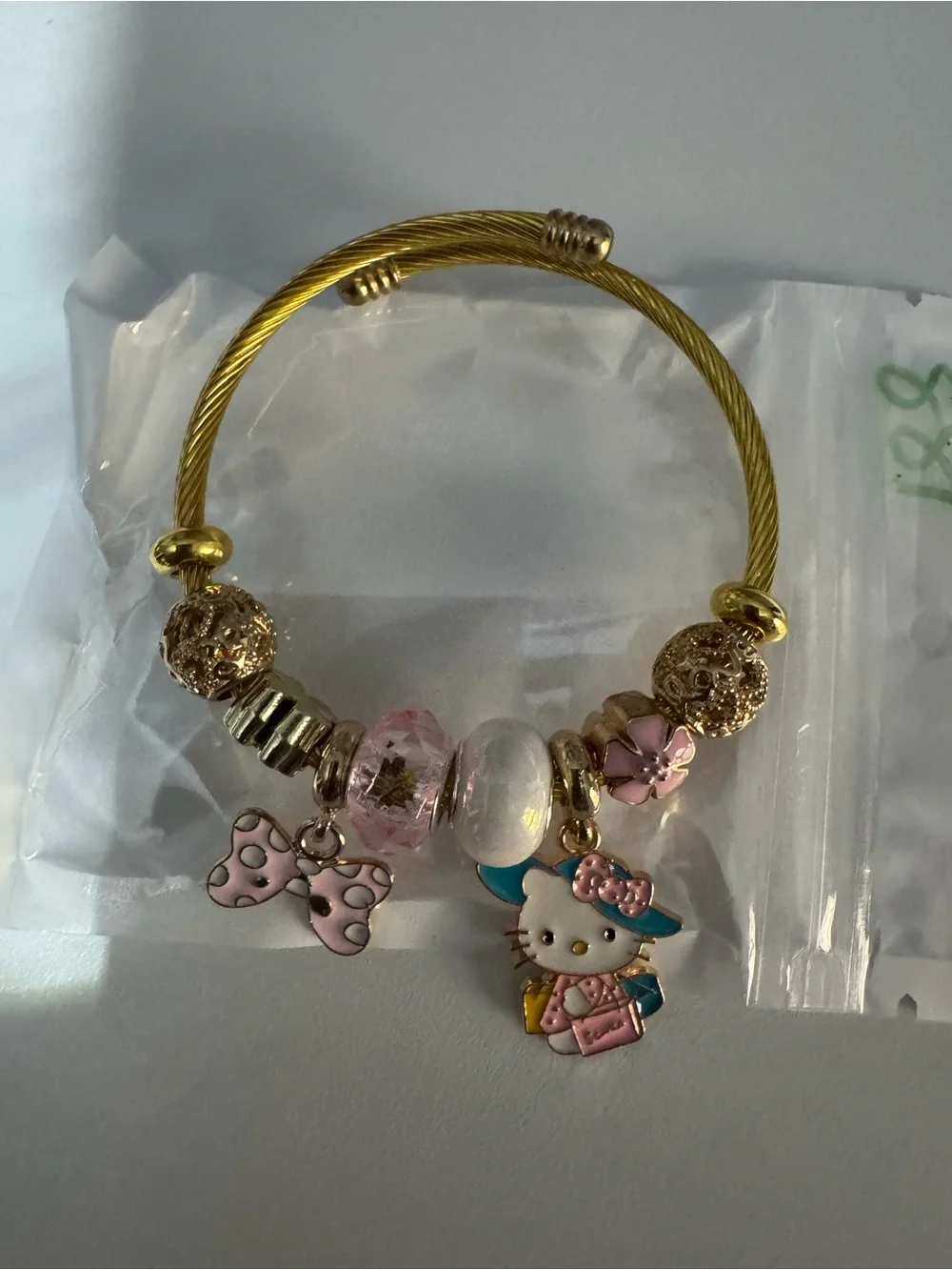 Hello Kitty Gold-Tone Charm Bracelet - Pink Accents